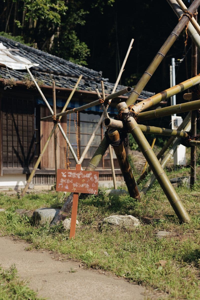 A bamboo jungle gym and a hand-painted sign